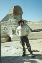 Scott Farrell on the Giza plateau standing in front of the Sphinx in Egypt